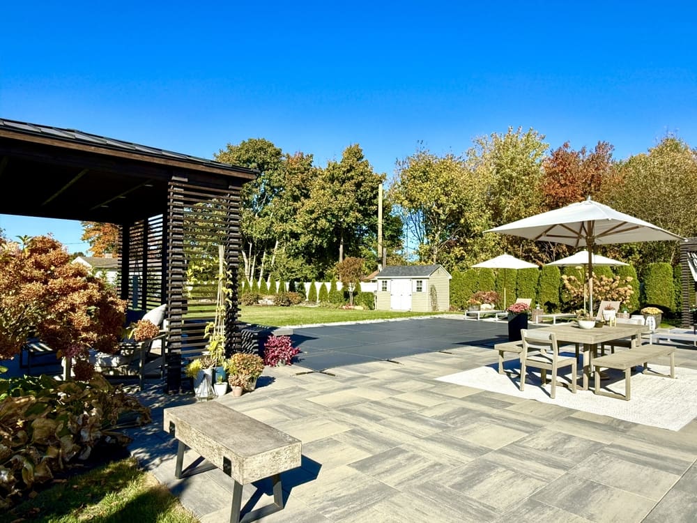 How can you keep a pool warm longer in the fall